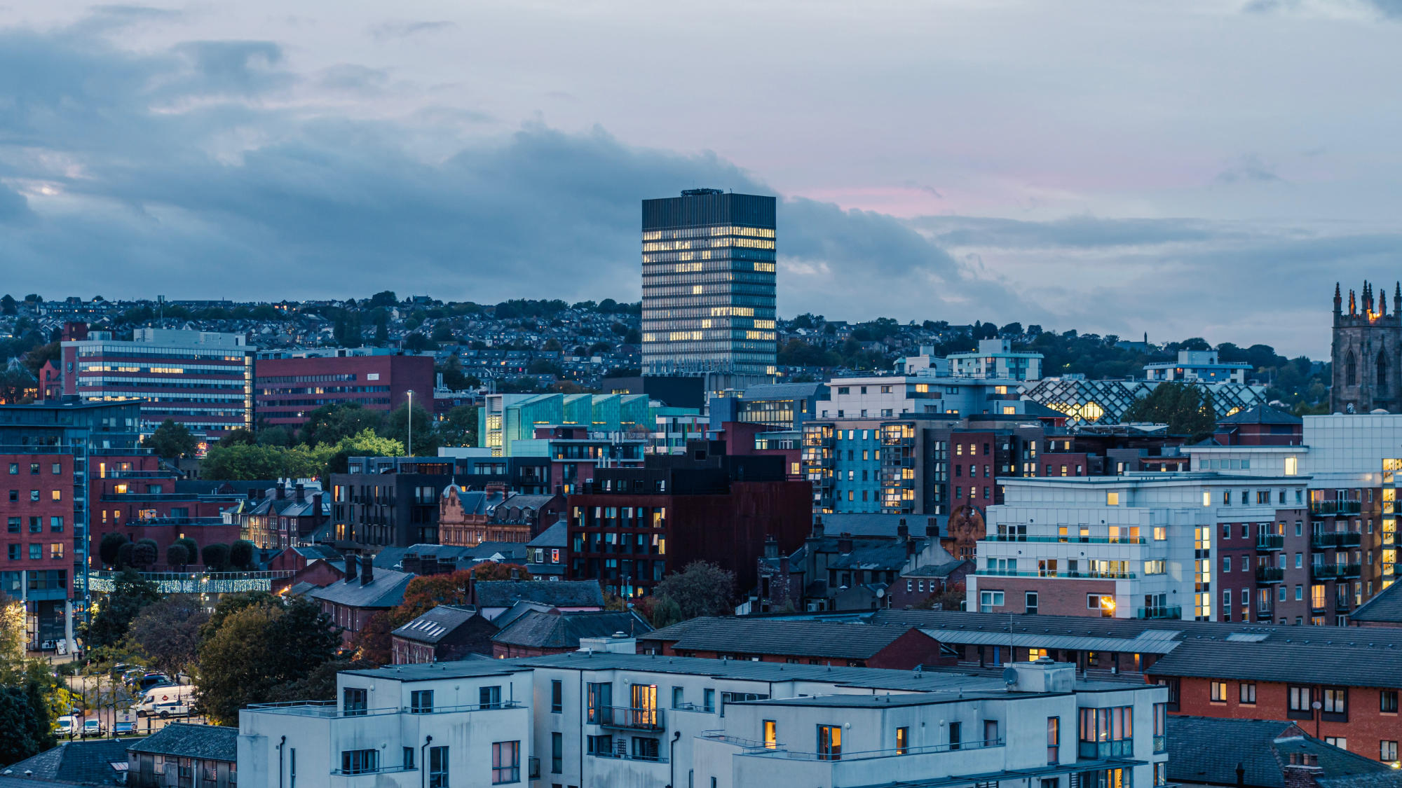 Night time image of Sheffield used as background.